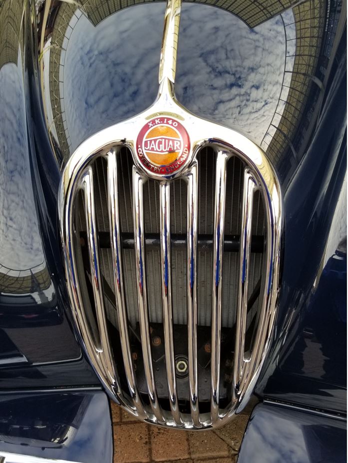 Just look at the clouds in the sky reflected in the shine on that XK140!