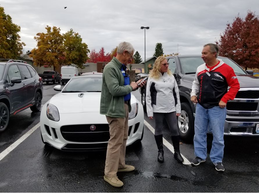Kurt Jacobson with Patty McKerney and Kurt Hrubant in front of their white F-Pace.