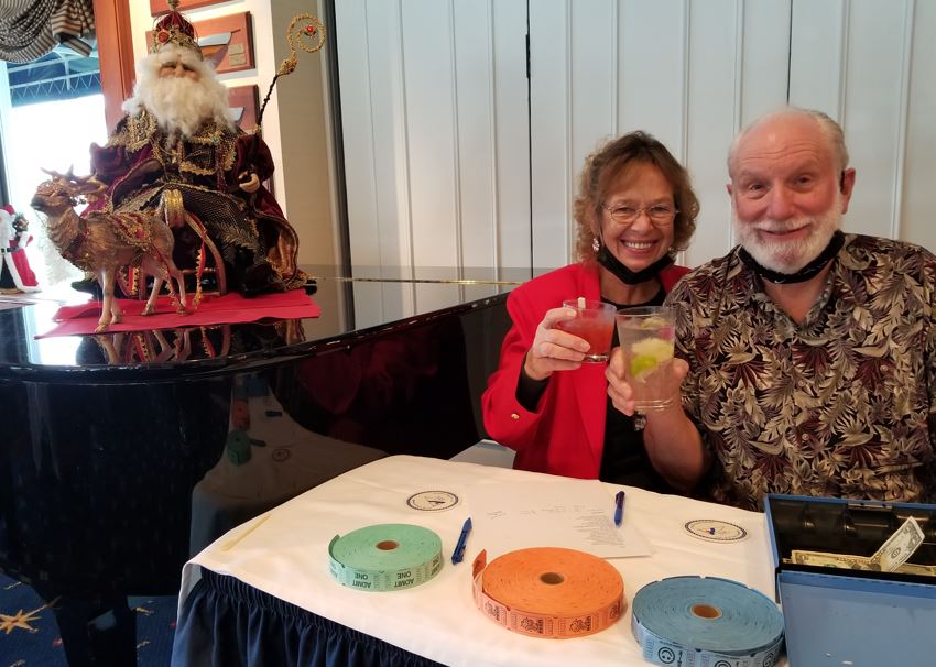 Linda Roberts, Treasurer, had to work at the party, selling the tickets for drinks and collecting the auction money.   But I think her and Ray Papineau still had a good time!