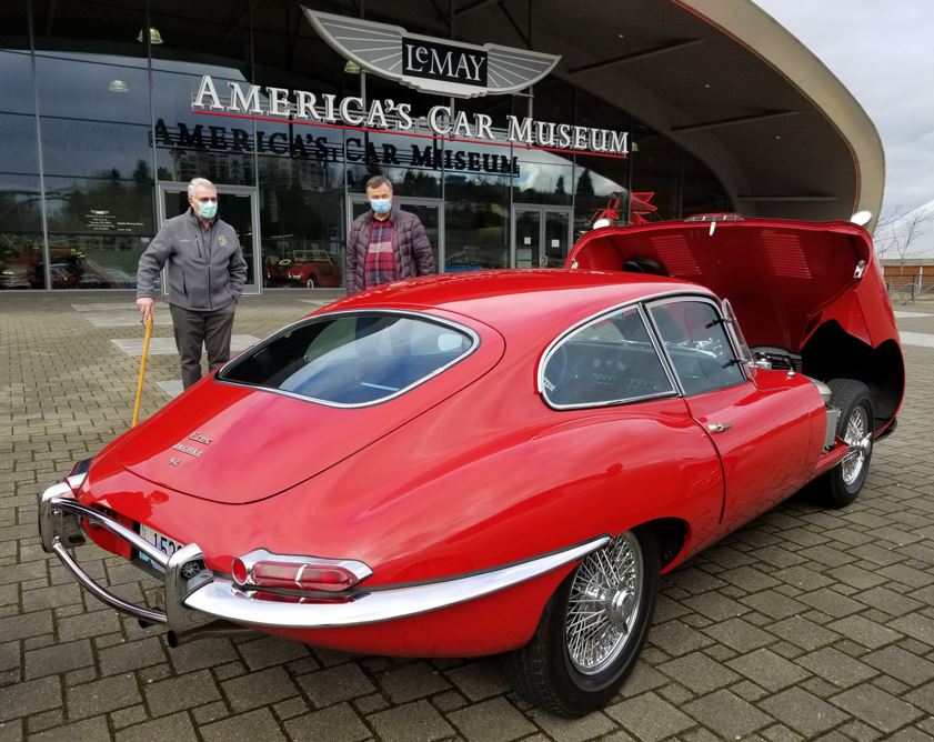 On 1/8/2022 the Seattle Jaguar Club held its Annual General Meeting at LeMay-America's Car Museum.   Any Jaguars were allowed to park on the plaza right in front.  Brian Case on left, discussing Ray Papineau's E-Type.